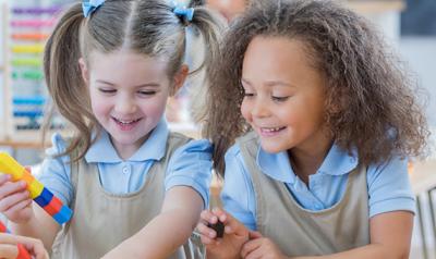 young girls playing with blocks